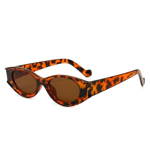 Retro leopard print oval sunglasses with dark brown lenses and thick plastic frames