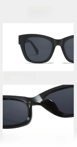 Close-up detail of black oversized square sunglasses frames and nose pads