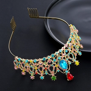 Close-up of crystal bridal crown with colorful rhinestones and gold alloy metal details