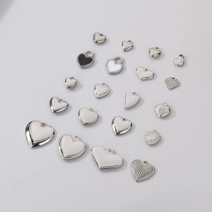 Polished stainless steel heart-shaped pendants with enamel details in various designs