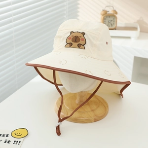 Detailed view of quick-dry sun hat with cute capybara patch and adjustable chin strap