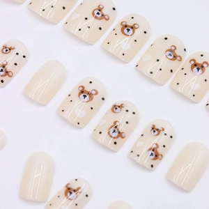 Cute brown bear and heart pattern press-on nails set with creamy base and dots