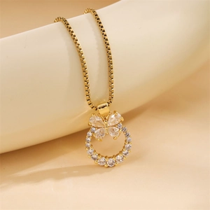 Elegant gold butterfly necklace with cubic zirconia circles and polished finish