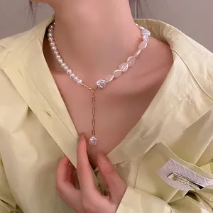 Asymmetric necklace with baroque pearls, heart pendant, and gold fringe chain for women