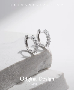 Elegant S925 sterling silver hoop earrings with round-cut moissanite on stone display