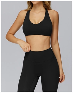 Close-up of the racerback design and stitching detail on black matte yoga sports bra