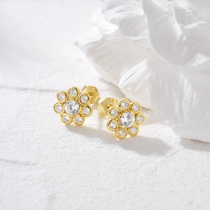 Macro view of golden sunflower stud earrings featuring S925 silver hallmark and zircons