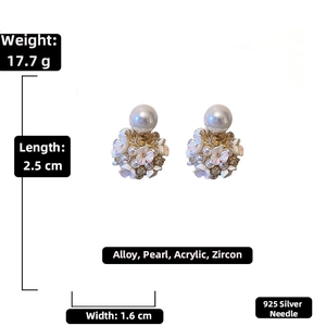 Detail view of 925 silver needle floral earrings with pearls and zircon in macro photography