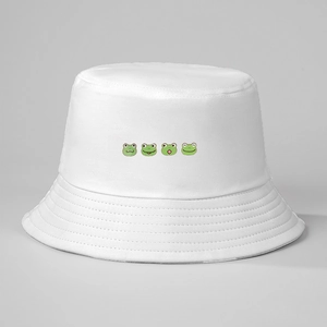 Detail of white cotton bucket hat with cute green cartoon frog prints and neat stitching