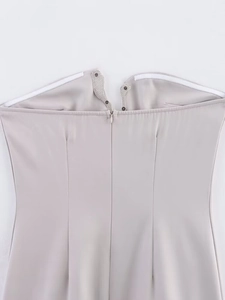 Detail of rhinestone mini dress with hidden back zipper and non-slip silicone strip