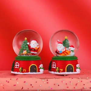 Luminous Christmas crystal ball with Santa and snowman scenes on a red house base