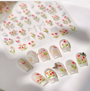 Close-up of M-1005 tulip nail stickers with floral butterfly motifs and 3D press-on nails