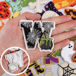 Halloween alphabet embroidery patches with festive motifs and adhesive backing for DIY clothing