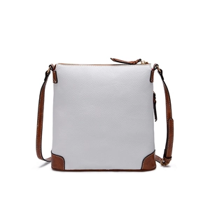Detailed view of white pebbled leather texture and brown stitched seams on crossbody bag