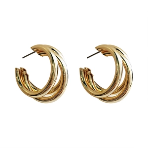Elegant multi-layer gold C-shaped hoop earrings with a minimalist triple ring design