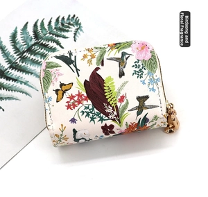 Top view of large capacity card wallet with hummingbird and floral paint pattern