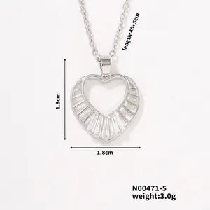 Detailed view of silver heart pendant with baguette cut zircon stones on silver chain