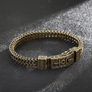 Detail of bronze hip hop double chain bracelet with Egyptian Ankh cross clasp