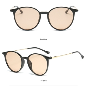 Detailed front and side view of round sunglasses with light orange lenses and black frames