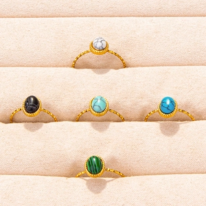 Set of five 304 stainless steel gold rings with colorful oval stones in a velvet display box