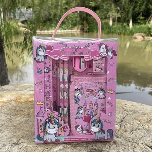 Pink unicorn stationery set detail with pencils and ruler shown in outdoor setting