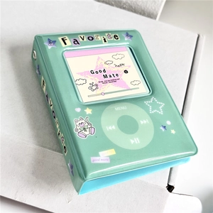 Close-up of green retro iPod style PVC photo album with cute stickers and glossy finish