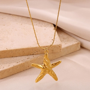 18K gold-plated stainless steel starfish pendant necklace on natural stone and silk fabric