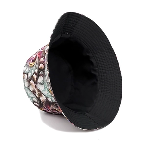 Reversible bucket hat with abstract art fluid print and black lining for sun protection