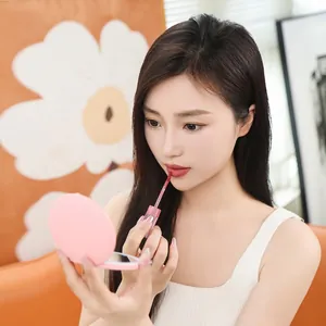 Portable pink LED makeup mirror with 360-degree ring light for flawless beauty application