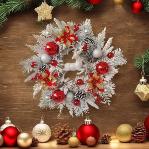 Christmas wreath with white reindeer, red poinsettia and ornaments on wooden wall