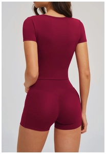 Rear view of burgundy yoga set featuring high waist shorts with V-shaped back seam detail