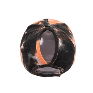 Tie-dye ponytail baseball cap for women with adjustable velcro strap and orange pattern