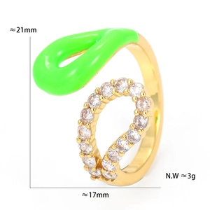Detailed view of gold open ring featuring green enamel finish and sparkling zircon crystals