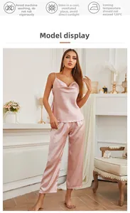 Close-up of silk camisole top with draped neck and loose trousers in elegant pink