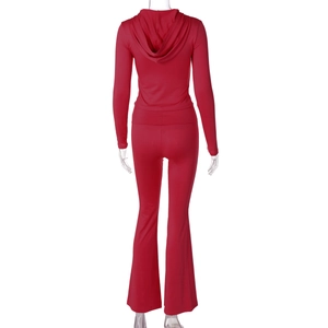 Rear view of red slim fit zip hoodie and high-waisted flared pants two-piece set