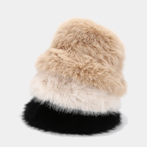 Vertical stack of khaki, beige and black faux fur bucket hats showing plush texture
