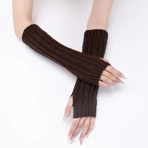 Close-up of coffee brown cable knit fingerless gloves showing thick textured arm warmers