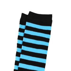 Detailed view of blue and black striped knee-high socks with ribbed cuffs and knit texture