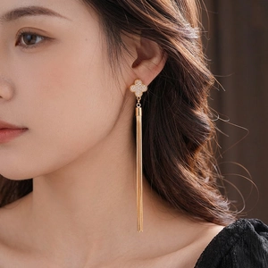 Luxurious four-leaf clover tassel earrings with sparkling zircon stones in gold finish