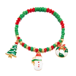 Detailed view of Christmas beaded bracelet with festive tree and snowman alloy charms