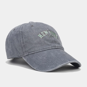 Detail of vintage washed grey cotton baseball cap with New York letter embroidery