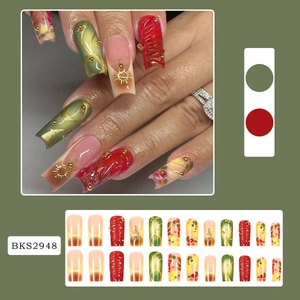 3D brushed gradient press-on nails set with gold sun charms in red and green colors