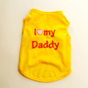 Detail of a bright yellow cotton dog vest featuring a red I Love My Daddy print design