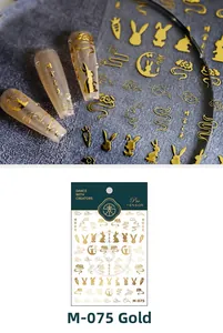 Macro detail of M-075 golden 3D nail stickers with traditional Chinese rabbit and cloud motifs