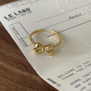 Elegant 925 sterling silver golden bow open ring with textured bead details