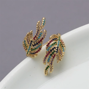 Macro shot of 18K gold plated leaf ring with colorful cubic zirconia stones and open design