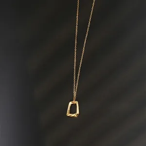 Minimalist gold geometric pendant necklace with matte finish on thin titanium O-chain