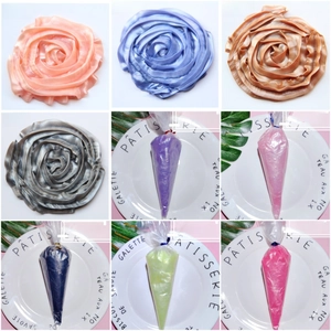 Macro detail of pearlescent DIY cream glue in nine colors for crafting handmade flower shapes