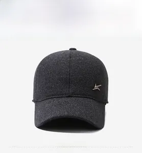Detail of grey wool blend baseball cap with metallic logo and textured fabric finish