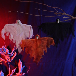 Three colorful Halloween hanging ghosts with plastic skulls on dry branches for spooky decor